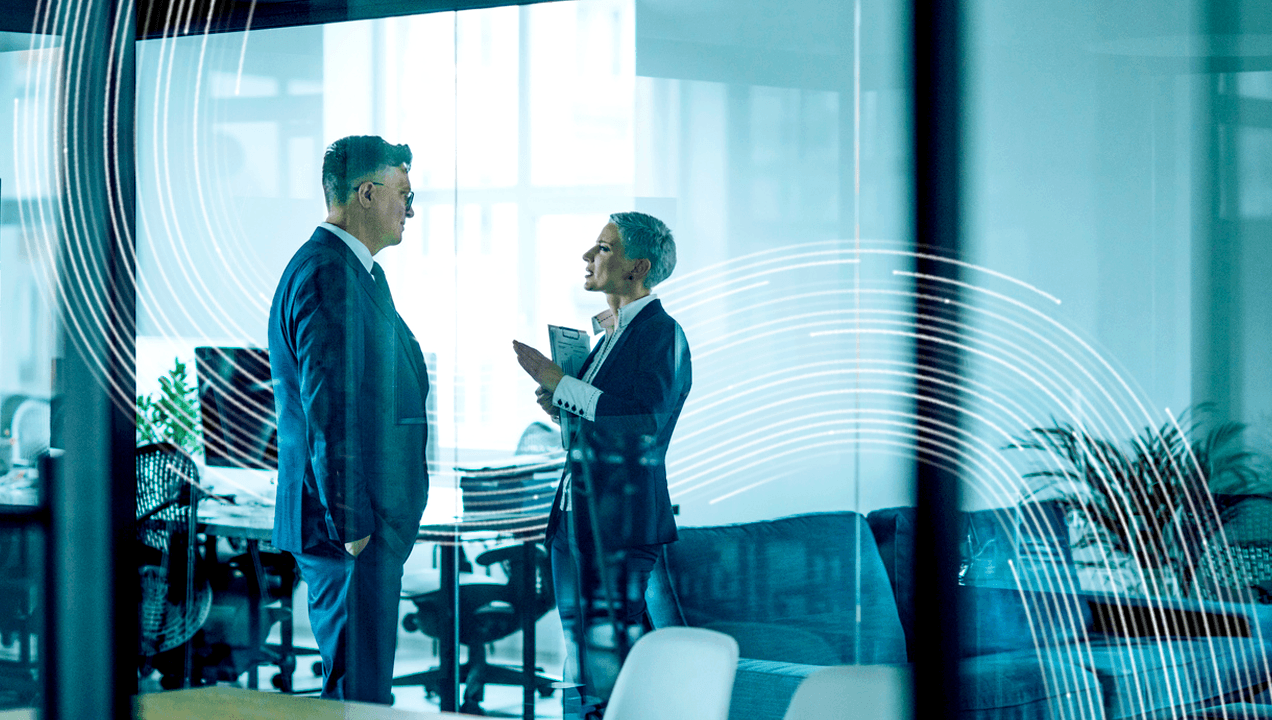 Two business people having a discussion in the office